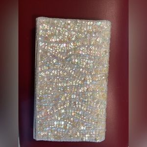 Vintage beaded and sequin cream color clutch with braided cord strap. Champagne